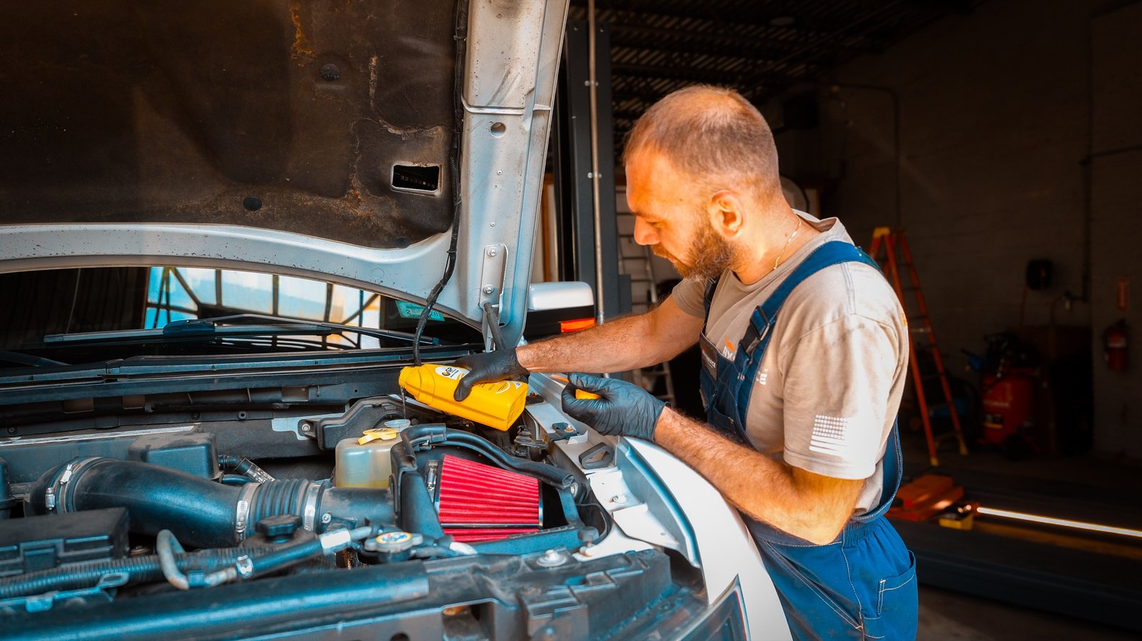 Technician servicing an engine at FIX SERVICE