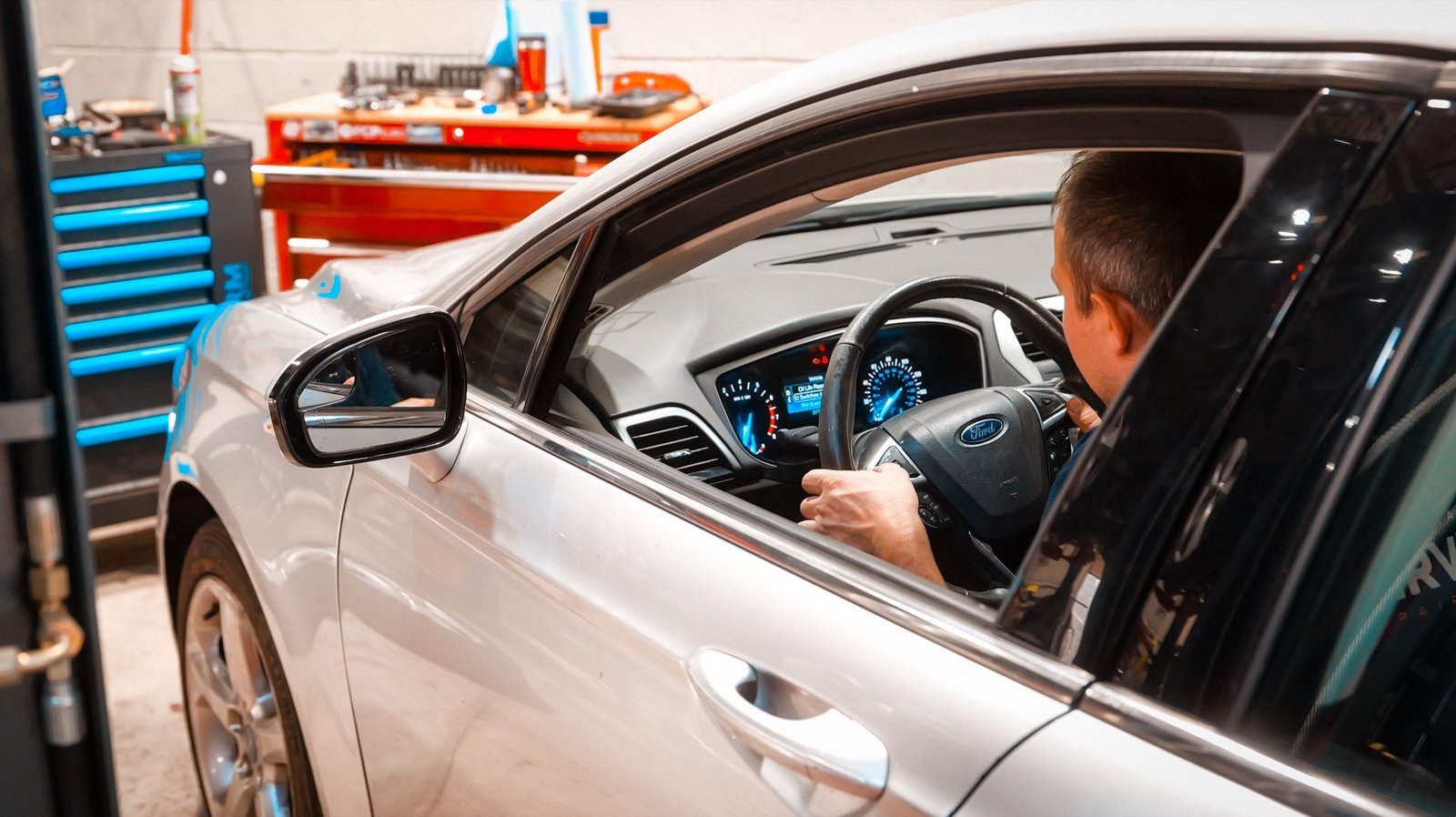 Technician performing dashboard diagnostics